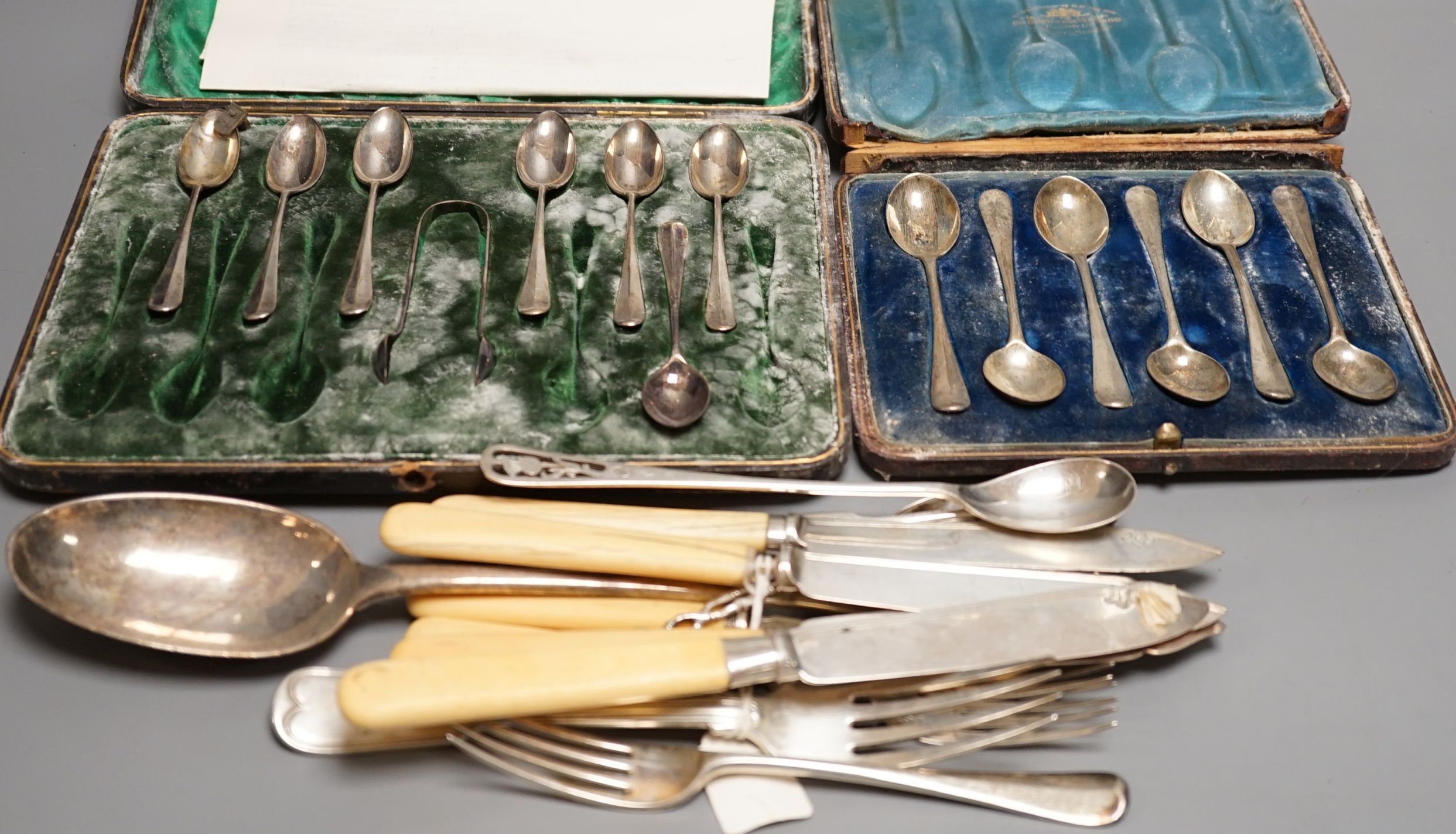 A quantity of 19th century and later assorted silver cutlery, including Edwardian basting spoon, various dates and makers, ten dessert eaters, a set of six Chinese white metal teaspoons by Wang Hing, two cased sets of si
